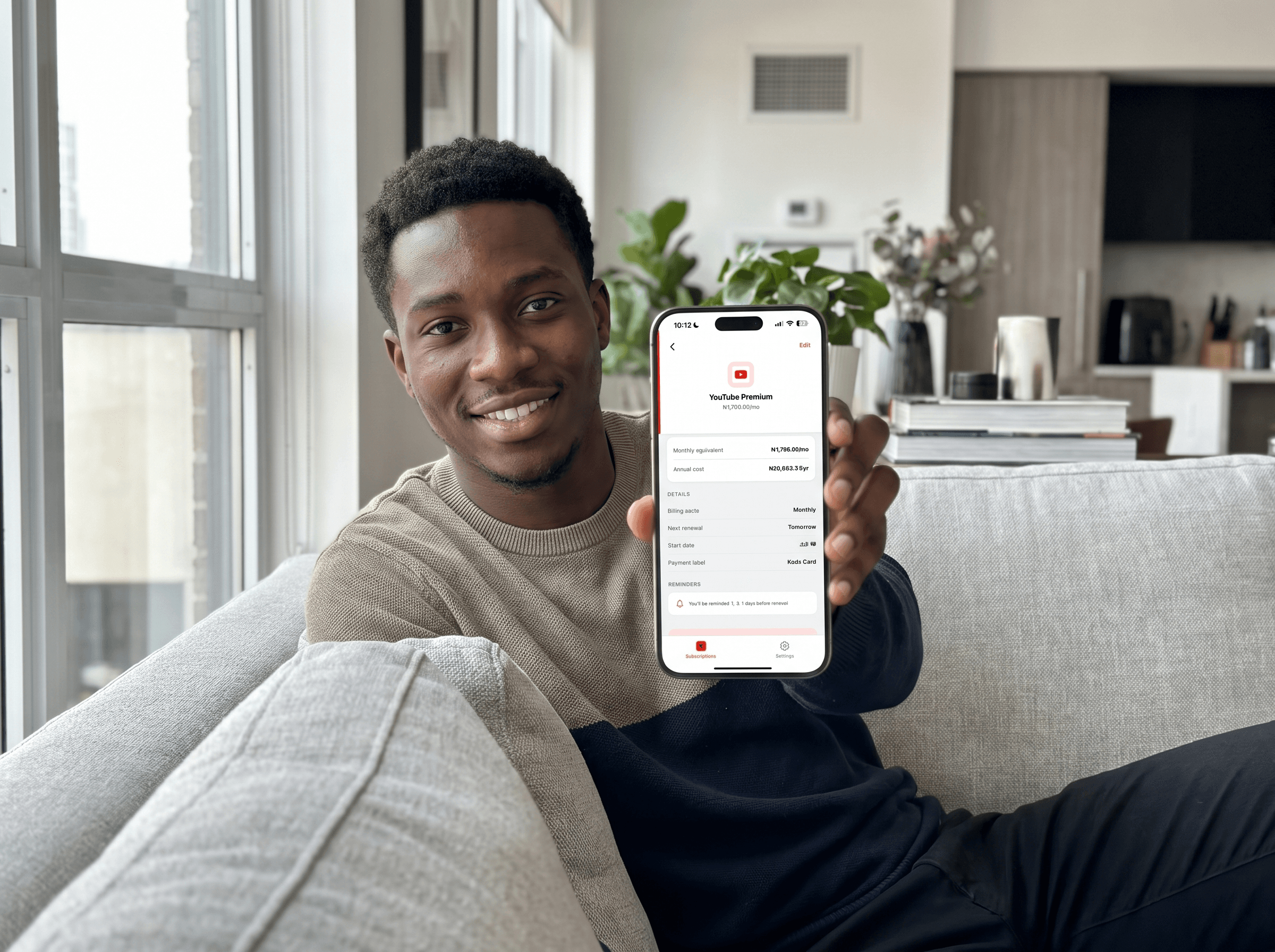 Person showing Harbingr subscription renewals and reminders on iPhone